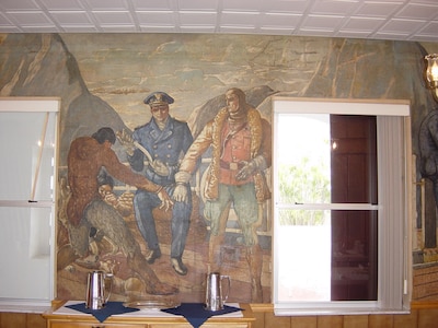 Air Station Clearwater, Florida (Formerly Air Station St. Petersburg) Wardroom mural inside the Officers' & CPO Mess.  This building was constructed in the 1937-38 time frame and the interior of the Officers' Mess was painted by a local artist, George Snow Hill, under the Works Progress Administration's Federal Art Program.  Each wall of the Mess depicted a historic event in Coast Guard history or one of the service's many missions conducted in the 1930s.  Photos & information courtesy of the Ancient Order of the Pterodactyls.