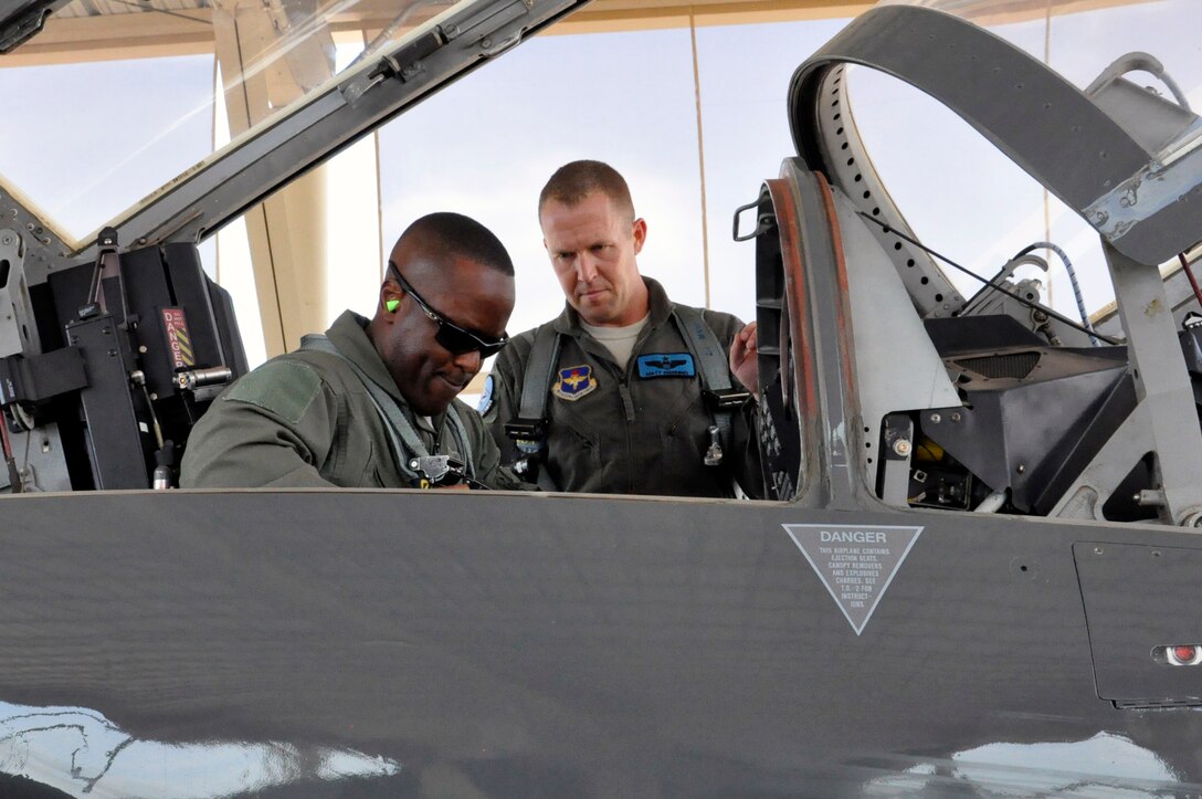 Brig. Gen. Ronald Jolly, 82nd Training Wing commander, straps into a T-38 Talon with the help of Lt. Col. Matthew Manning at Sheppard Air Force Base, June 8, 2017. Sheppard's 80th Flying Training Wing is home to the Euro-Nato Joint Jet Pilot Training program, the world's only pilot training program for the NATO alliance. (U.S. Air Force photo by Debi Smith)