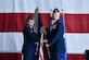 Maj. Gen. Mary F. O’Brien, 25th Air Force commander, presents Col. Michael Manion with the 55th Wing guidon during a chang of command ceremony in Dock 1 of the Bennie Davis Maintenance Facility June 8. The Fightin' Fifty-Fifth said farewell to Col. Marty Reynolds and welcomed Col. Manion.
