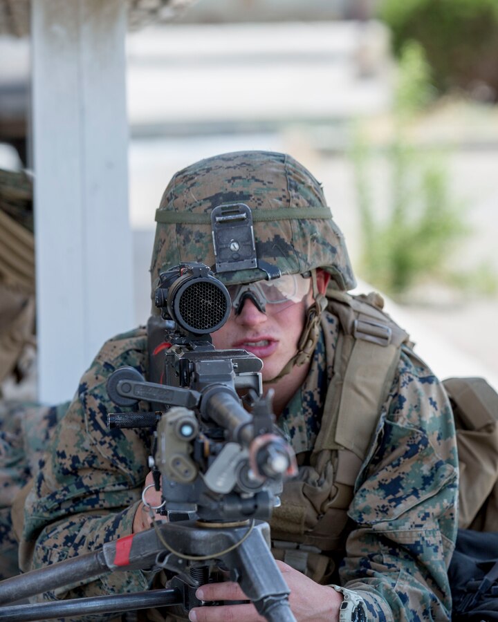 Private First Class Noah Perkins, a machinegunner with 1st Battalion, 5th Marines, holds his position during a training exercise aboard Marine Corps Logistics Barstow, June 6.