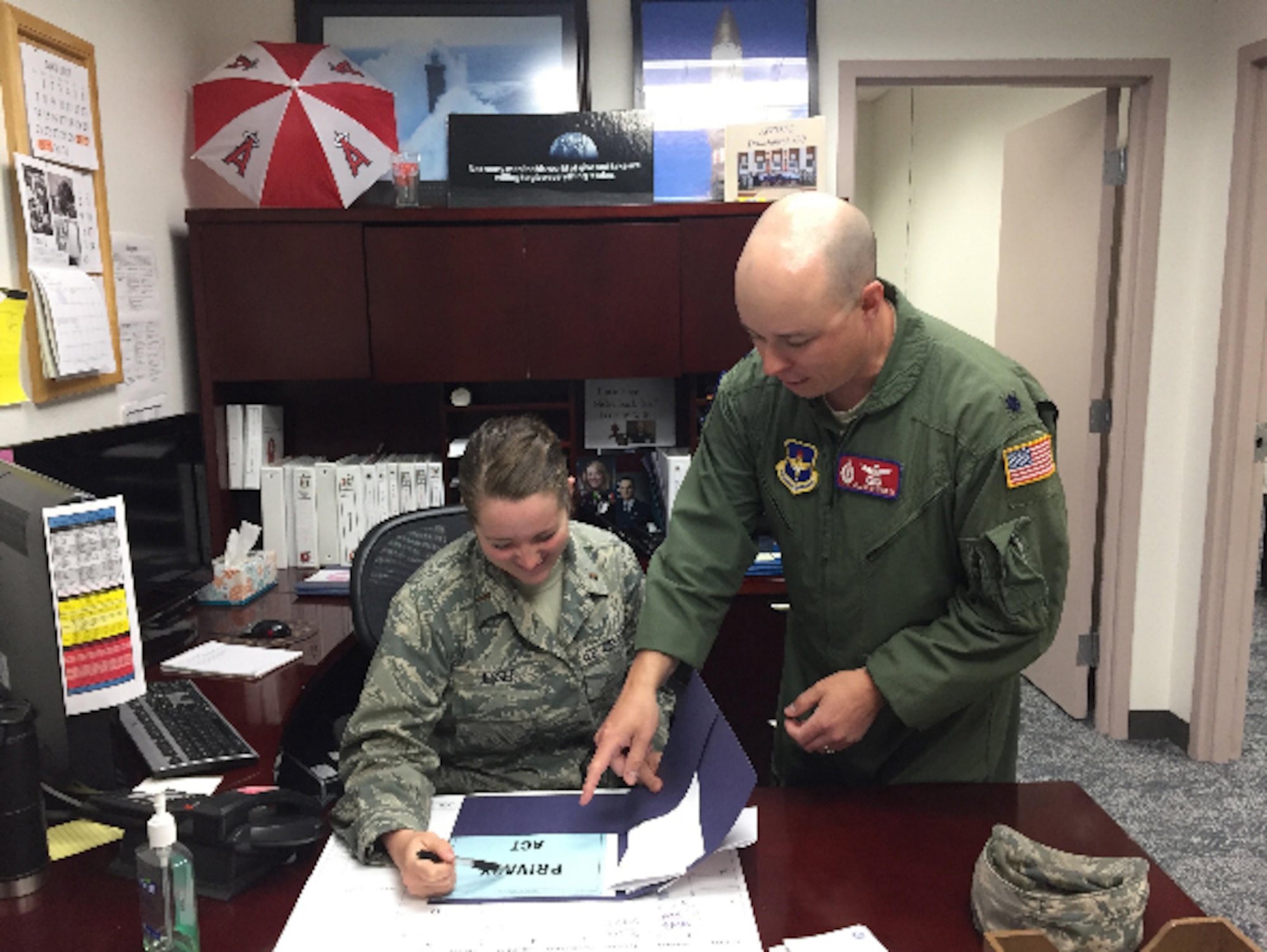 2nd Lt. Sarah Jessee, 532nd Training Squadron casual status lieutenant, works with Lt. Col. William Weiford, 532nd TRS director of operations, June 1, 2017, Vandenberg Air Force Base, Calif. For the past 30 years a small percentage of officers arrive at the 381st Training Group, for technical training, without a security clearance which prevents them from starting classes. (courtesy photo)