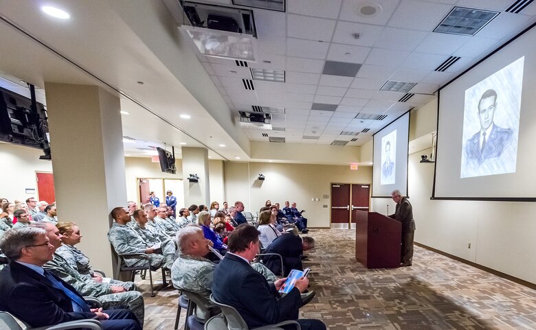 The portrait of the first Air Force Office of Special Investigations Fallen Special Agent, Lee Hitchcock, is shown on two large screens during the OSI headquarters inaugural Celebration of Life Remembrance Ceremony May 22, 2017, at Quantico, Va. (U.S. Air Force photo/Mr. Michael Hastings)  