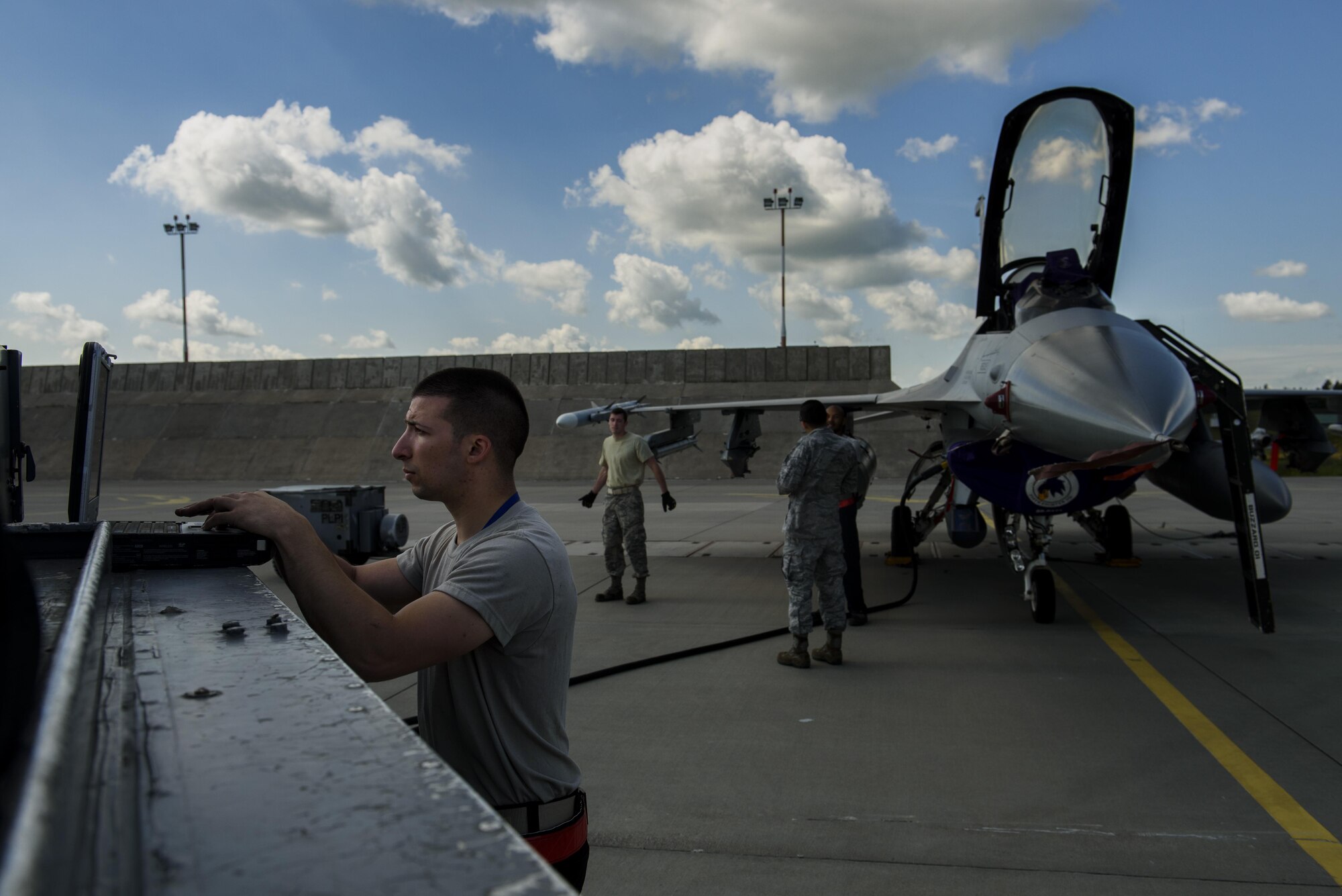 Airman 1st Class Jordan Desisto, 31st Maintenance Squadron crew chief, looks at technical orders on a F-16 Fighting Falcon, 510th Fighter Squadron, during BALTOPS at Krzesiny Air Base, Poland, June 8, 2017. The exercise is designed to enhance flexibility and interoperability, to strengthen combined response capabilities, as well as
demonstrate resolve among Allied and Partner Nations' forces to ensure stability in, and if necessary defend, the Baltic Sea region. (U.S. Air Force photo by Staff Sgt. Jonathan Snyder)