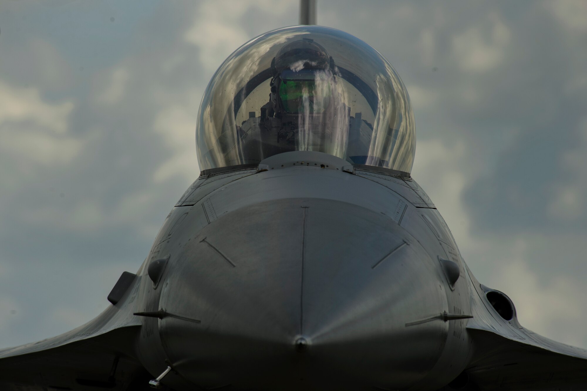 Airman 1st Class Jordan Desisto, 31st Maintenance Squadron crew chief, looks at technical orders on a F-16 Fighting Falcon, 510th Fighter Squadron, during BALTOPS at Krzesiny Air Base, Poland, June 8, 2017. The exercise is designed to enhance flexibility and interoperability, to strengthen combined response capabilities, as well as demonstrate resolve among Allied and Partner Nations' forces to ensure stability in, and if necessary defend, the Baltic Sea region. (U.S. Air Force photo by Staff Sgt. Jonathan Snyder)