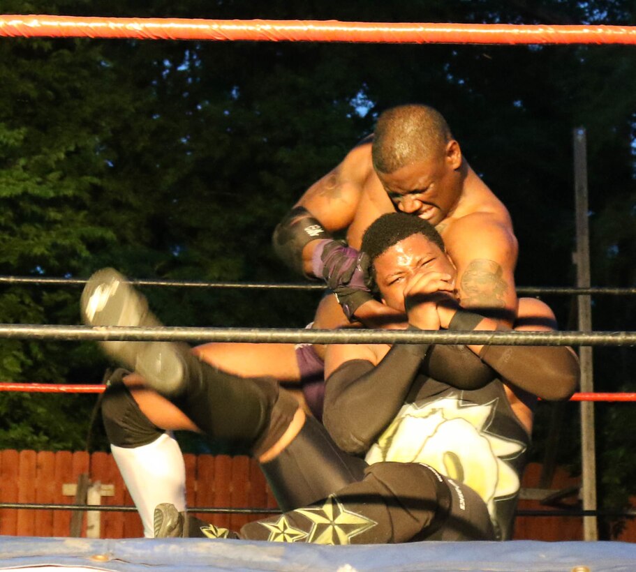 U.S. Army Reserve Sgt. Trenty Watford, a microwave communications specialist with the 4th Sustainment Command (Expeditionary), as ‘T-Ray,’ performs a choke hold on ‘K.O. Cox’ in a professional wrestling match in San Antonio, Texas, on Jun. 3, 2017.  The U.S Army Reserve is full of citizen-soldiers who balance a civilian job with their service in the military.  This balance can be a challenge, but these warrior-citizens persevere, keeping the U.S. Army Reserve a capable, combat-ready and lethal force.  (U.S. Army Reserve Photo by Maj. Brandon R. Mace)