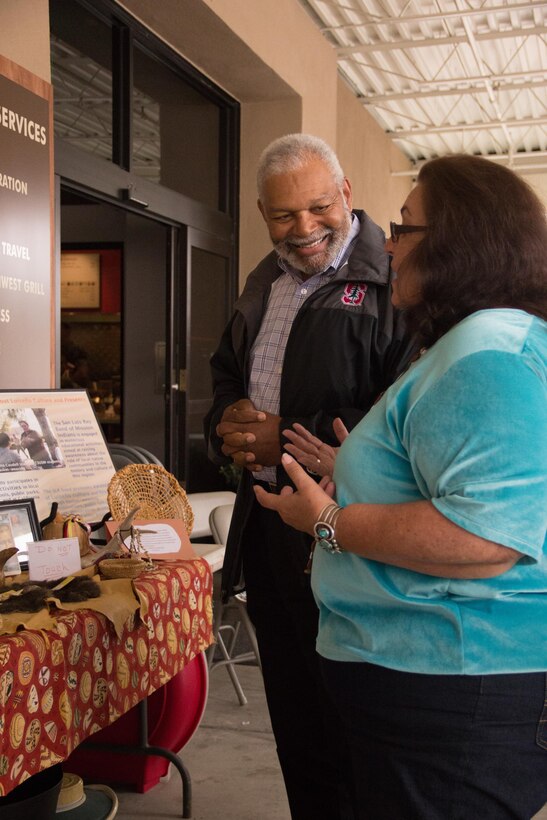 Diania Caudell discusses her Luiseno basket weaving display with Dr. Anthony Baxter, 1st Marine Division prevention analyst, at the Marine Corps Installations West, Marine Corps Base Camp Pendleton Multi-Cultural Celebration, May 25, 2017. Military personnel and civilians alike spent the afternoon browsing booths of informative displays, homemade foods and crafts. (U.S Marine Corps Photo by Lance Cpl. Desiree D King)