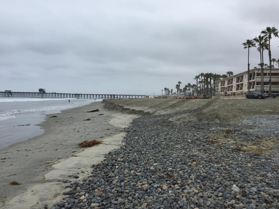 Cobble lies on the beach just south of the end of the placement of material dredged from the Oceanside Harbor entrance channel. The Corps and the City of Oceanside, the project's sponsor, dredged more than 400,000 cubic yards of sand from the channel and placed it along the city's shoreline from the mouth of the San Luis Rey River to south of the Oceanside Pier.