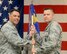 Maj. Christopher Osborne, right, accepts the 71st Security Forces Squadron guidon from Col. Dwayne LaHaye, the 71st Mission Support Group commander, during a change-of-command ceremony May 30 in the Armed Forces Reserve Center at Vance Air Force Base, Oklahoma. (U.S. Air Force photo/ Terry Wasson)