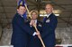 Col. Todd Cargle, 92nd Operations Group commander, passes the 92nd Operations Support Squadron guidon to Lt. Col. Brett Fish, 92nd OSS commander, during a change of command ceremony June 8, 2017 at Fairchild Air Force Base, Washington. Fish assumed command from Lt. Col. Matt Coleman. (U.S. Air Force photo/Senior Airman Nick J. Daniello)