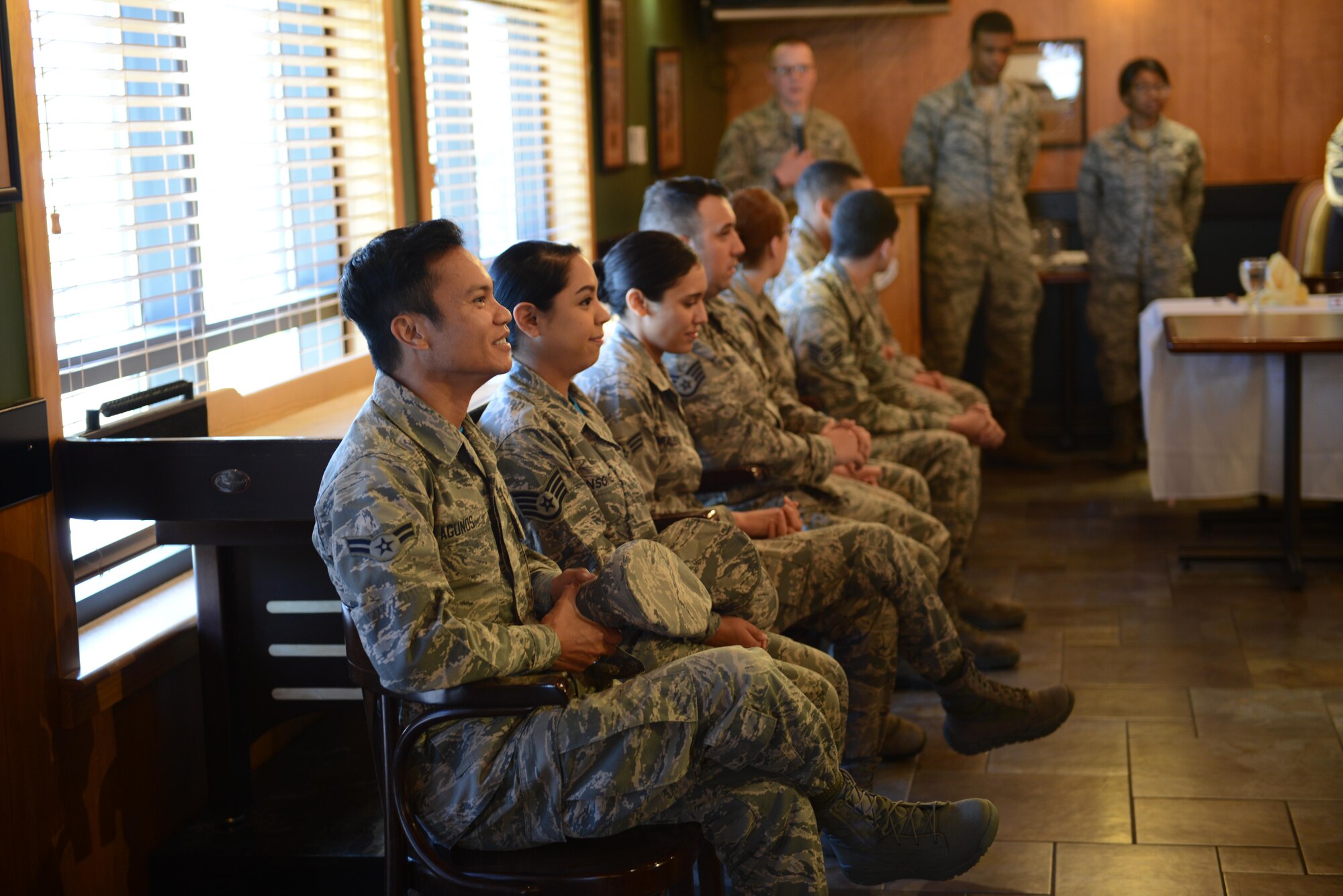 Airmen competing in the second quarter Warrior Chef competition listen to the guidelines of the competition during the opening ceremony at the Grizzly Bend June 7, 2017 at Malmstrom Air Force Base, Mont. Four teams of two had to prepare meals from scratch in under an hour using mangoes as the secret ingredient. (U.S. Air Force photo/Staff Sgt. Delia Marchick)