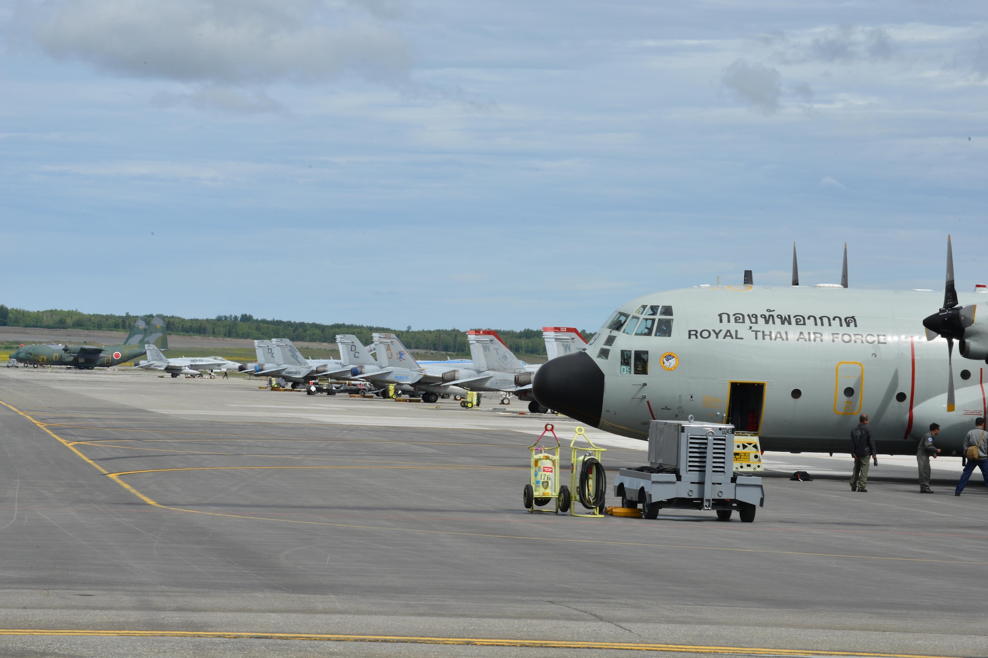 United States, Japanese Self-Defense Force, and Royal Thai Air Force aircraft wait on the Joint Base Elmendorf-Richardson, Alaska flightline for their next Operation Red Flag-Alaska mission, June 8. RF-A is a Pacific Air Forces-directed field training exercise for U.S. and international forces flown under simulated air combat conditions. It is conducted on the Joint Pacific Alaska Range Complex with air operations flown primarily out of Eielson Air Force Base and JBER. 