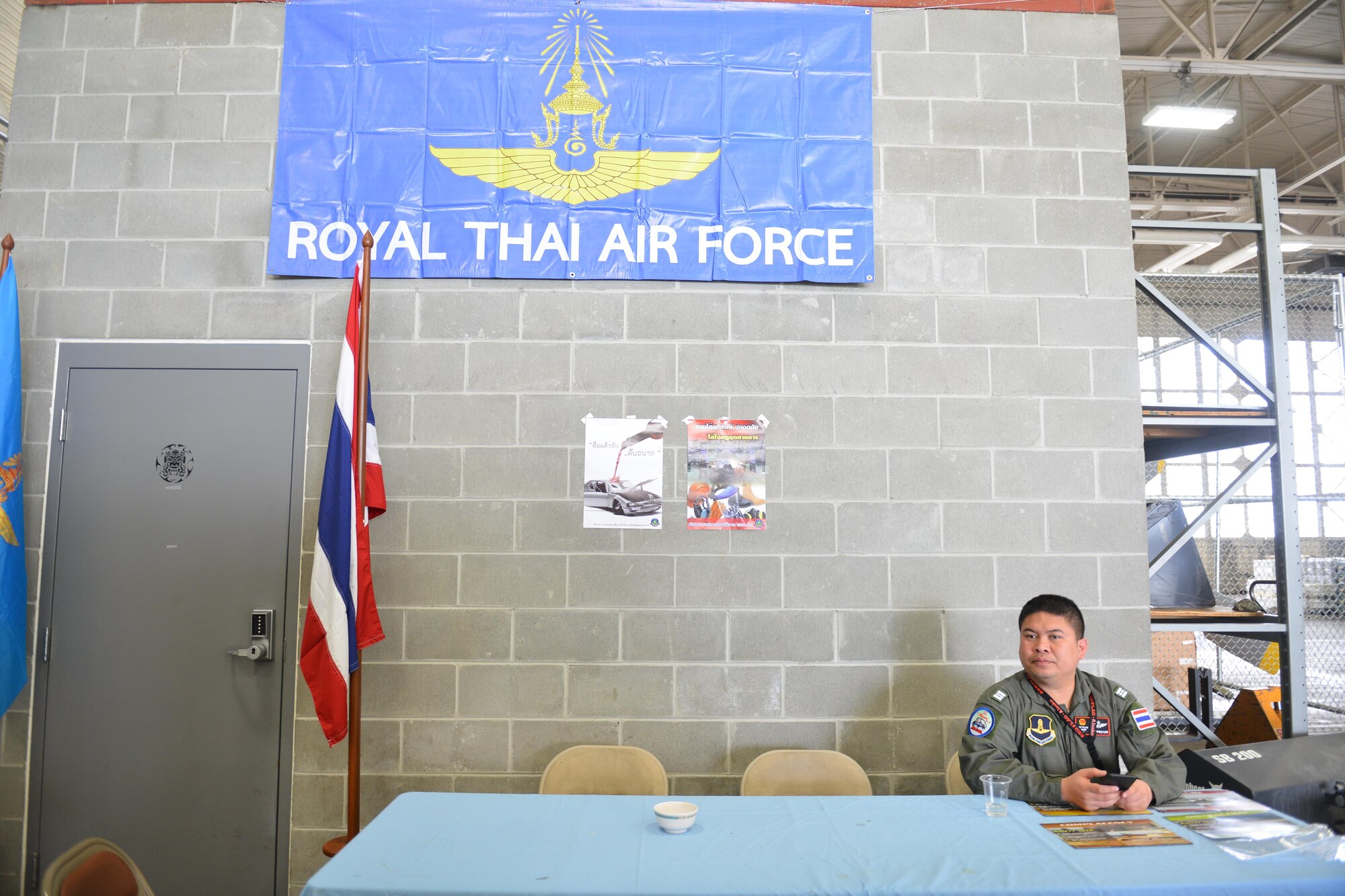 A Royal Thai Air Force Airman talks with a friend after finishing lunch on the Joint Base Elmendorf-Richardson, Alaska flightline, June 8. RF-A is a Pacific Air Forces-directed field training exercise for U.S. and international forces flown under simulated air combat conditions. It is conducted on the Joint Pacific Alaska Range Complex with air operations flown primarily out of Eielson Air Force Base and JBER.