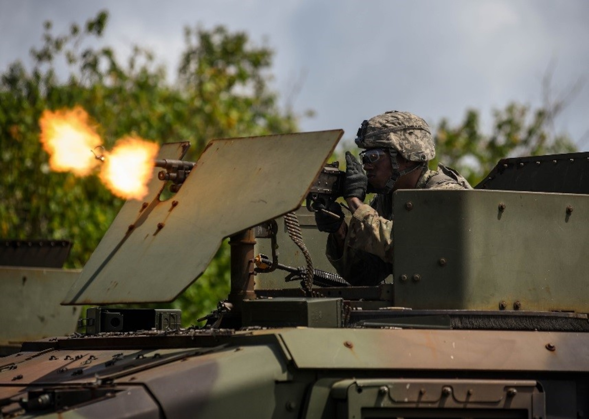 A U.S. Soldier from Task Force Talon, 94th Army Air and Missile Defense Command, fires blank rounds at opposing forces during a combat search and rescue training exercise June 5, 2017, at Andersen South, Guam. Service members from TFT, Helicopter Sea Combat Squadron Two-Five, and the 36th Wing joined together to practice survival, evasion, resistance and escape procedures, emergency evacuation techniques and quick reaction force training. This is the first time these units participated in a combat search and rescue exercise together on Guam. (U.S. Air Force photo by Staff Sgt. Joshua Smoot)
