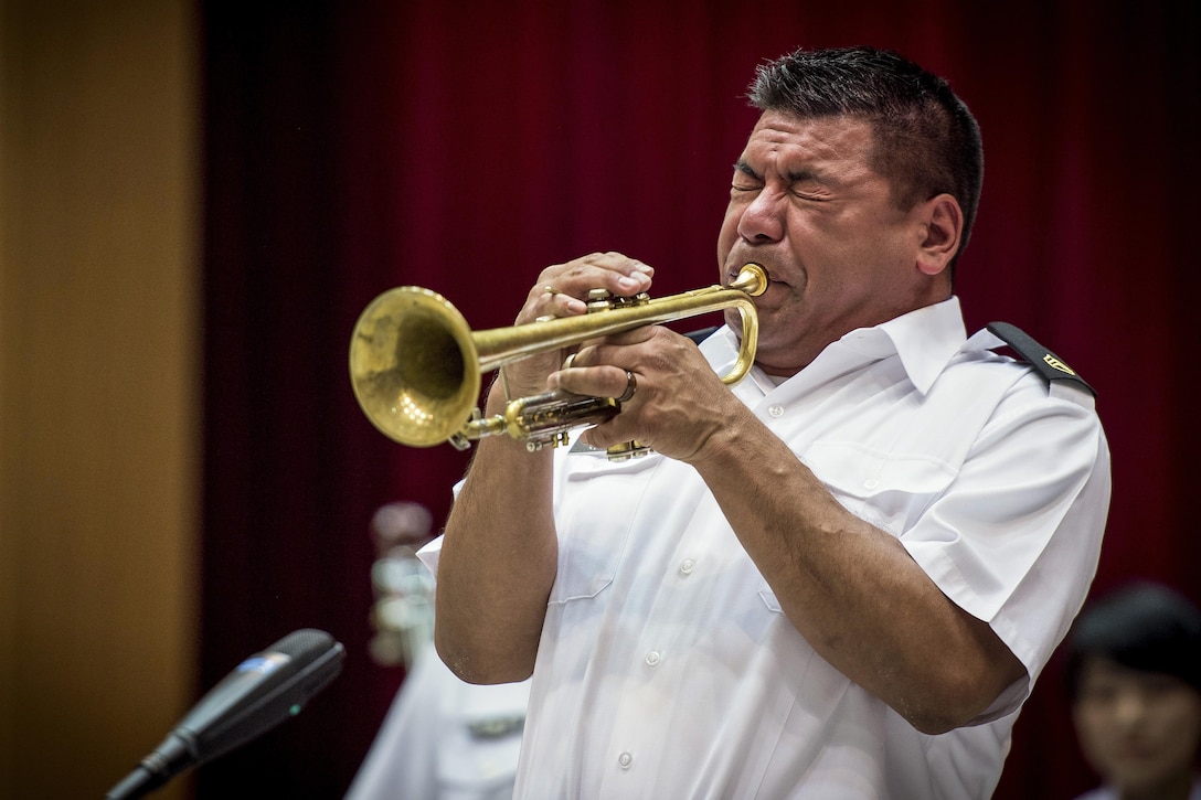 Army Staff Sgt. Joel Heredia performs a trumpet solo during a joint big band concert at the Japanese Ministry of Defense in Tokyo, June 7, 2017. U.S. and Japanese military bands performed together at the event, highlighting the strong alliance and friendship shared between the two nations’ forces. Air Force photo by Airman 1st Class Donald Hudson