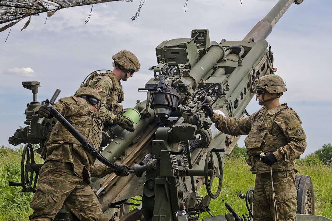 Soldiers load an M777A2 howitzer to prepare for a fire mission at Land Forces Field Training Center in Bemowo Piskie, Poland, June 6, 2017, as part of Saber Strike 17, a U.S. Army Europe-led multinational combined forces exercise. Army photo by Sgt. Justin Geiger