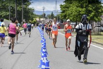A participant runs in costume during the 33rd Annual Yokota Striders Ekiden at Yokota Air Base, Japan, June 4, 2017. An Ekiden is a Japanese long distance relay that consists of teams of runners covering a certain distance. The Yokota Ekiden is 20K in distance made up of four runners each running a 5K. (U.S. Air Force photo by Machiko Arita)
