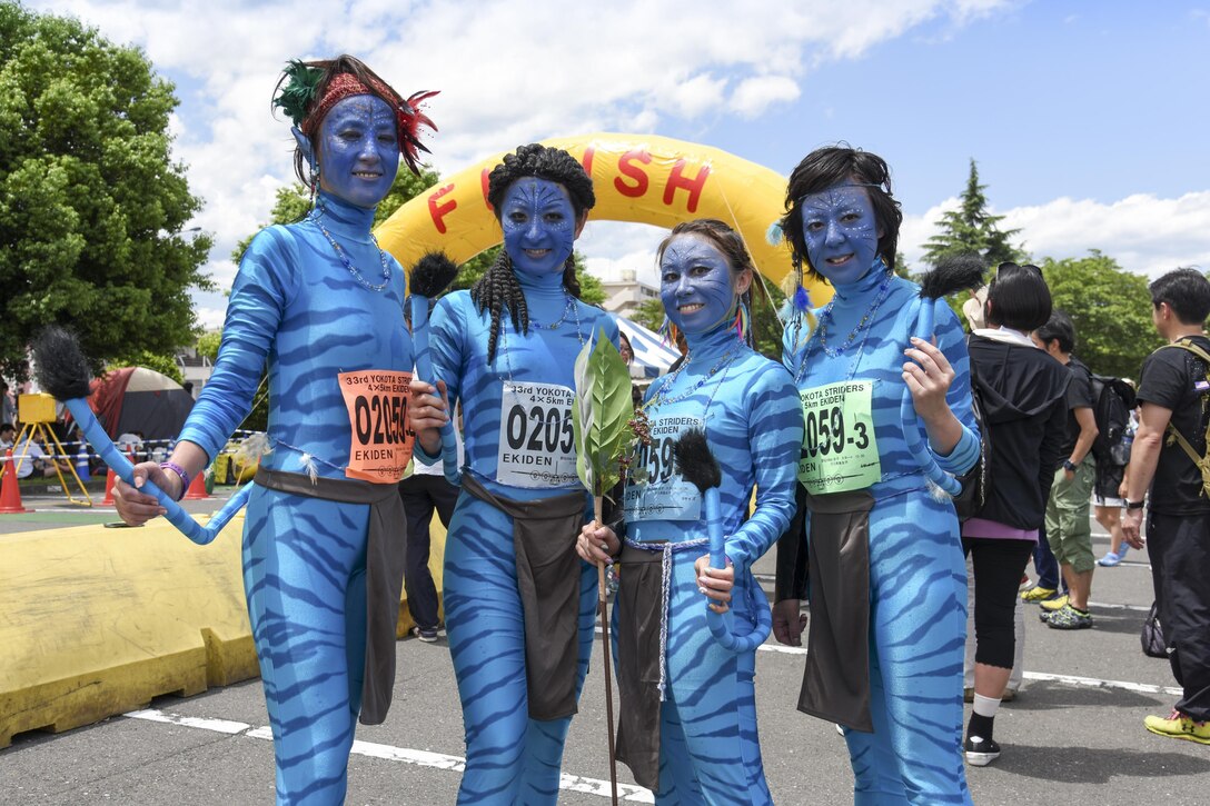 Runners dress up as Avatar characters and pose for a photo during the 33rd Annual Yokota Striders Ekiden at Yokota Air Base, Japan, June 4, 2017. More than 5,000 runners participated in the event hosted by the Yokota Striders Running Club. (U.S. Air Force photo by Machiko Arita)