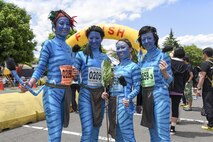 Runners dress up as Avatar characters and pose for a photo during the 33rd Annual Yokota Striders Ekiden at Yokota Air Base, Japan, June 4, 2017. More than 5,000 runners participated in the event hosted by the Yokota Striders Running Club. (U.S. Air Force photo by Machiko Arita)