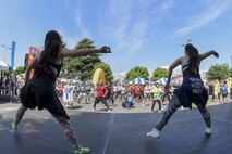 Zumba instructors lead race participants in a warmup before the 33rd Annual Yokota Striders Ekiden race at Yokota Air Base, Japan, June 4, 2017. More than 5,000 runners participated in the event hosted by the Yokota Striders Running Club. (U.S. Air Force photo by Machiko Arita)