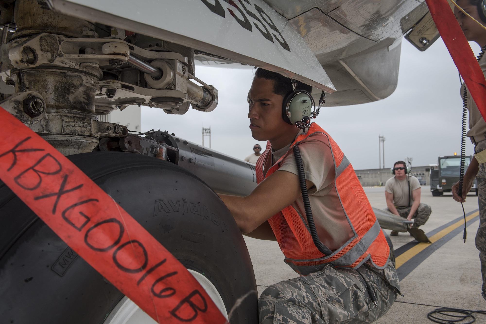 U.S. Air Force Airman Angel Manriquez,961st Aircraft Maintenance Unit crew chief apprentice, connects a tow bar to an E-3 Sentry from the 961st Airborne Air Control Squadron June 8, 2017, at Kadena Air Base, Japan. The AMU is comprised of crew chiefs and specialists who band together to ensure the E-3 Sentry AWACS maintains its operational capability. (U.S. Air Force photo by Senior Airman John Linzmeier)