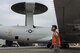 U.S. Air Force Airman Angel Manriquez, 961st Aircraft Maintenance Unit crew chief apprentice, conducts a ‘wing walk’ in order to help park an E-3 Sentry from the 961st Airborne Air Control Squadron June 8, 2017, at Kadena Air Base, Japan. Spotters position themselves at each side of the aircraft to ensure it does not collide with any obstructions. (U.S. Air Force photo by Senior Airman John Linzmeier)