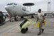 U.S. Air Force Staff Sgt. Mitchell Chappelle, 961st Aircraft Maintenance Unit radar technician, positions a fire extinguisher in front of an E-3 Sentry from the 961st Airborne Air Control Squadron June 8, 2017, at Kadena Air Base, Japan. The Sentry has rotating radar with a range of more than 250 miles, providing early warning and detection for missions. (U.S. Air Force photo by Senior Airman John Linzmeier)