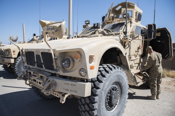 Staff Sgt. Dustin Tischner, 332nd Expeditionary Security Forces Squadron vehicle control non-commissioned officer, looks over a mine-resistant ambush protected all-terrain vehicle May 26, 2017, in Southwest Asia. Tischner trains Airmen on how to operate an M-ATV, ensuring they can safely maneuver it during different scenarios. (U.S. Air Force photo/Senior Airman Damon Kasberg)