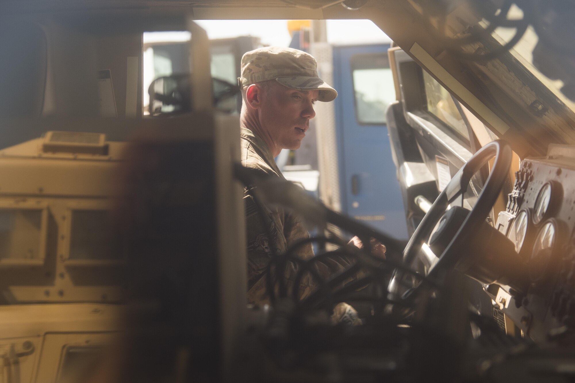 Staff Sgt. Dustin Tischner, 332nd Expeditionary Security Forces Squadron vehicle control non-commissioned officer, explains different feature of a mine-resistant ambush protected all-terrain vehicle to Airmen, May 26, 2017, in Southwest Asia. The M-ATV includes a variety of upgrades from previous vehicles used by security forces. (U.S. Air Force photo/Senior Airman Damon Kasberg)