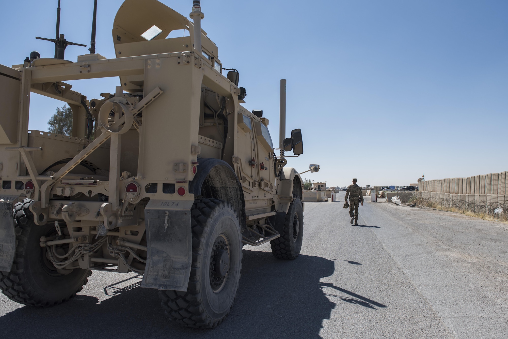 Staff Sgt. Dustin Tischner, 332nd Expeditionary Security Forces Squadron vehicle control non-commissioned officer, guides a mine-resistant ambush protected all-terrain vehicle down a road May 26, 2017, in Southwest Asia. Tischner trains Airmen on how to operate an M-ATV, ensuring they can safely maneuver it during different scenarios. (U.S. Air Force photo/Senior Airman Damon Kasberg)