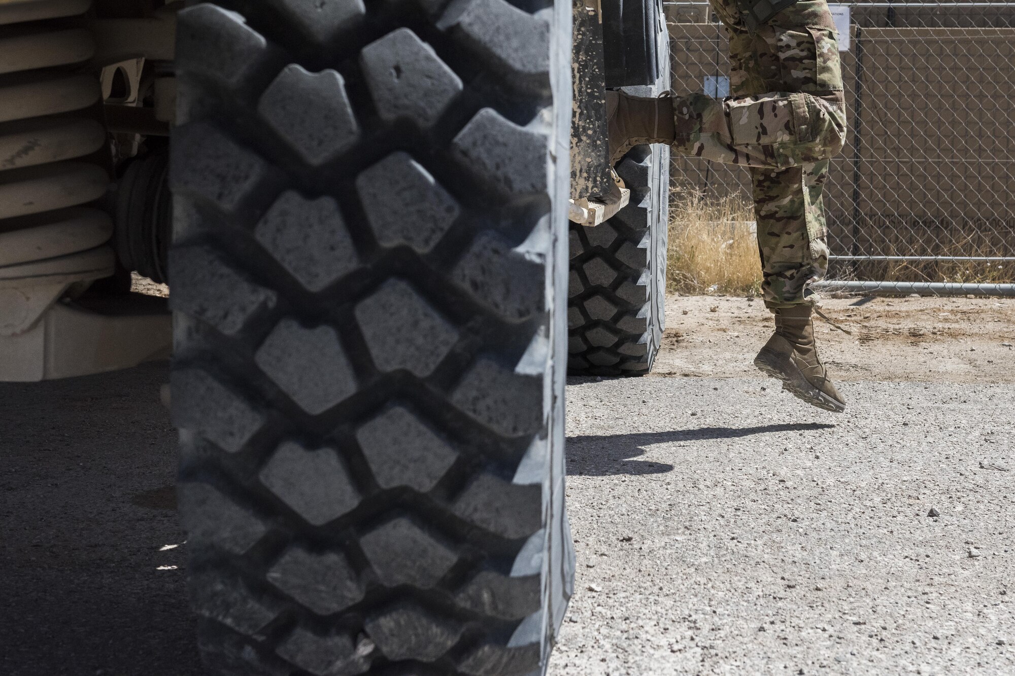 Airman Troy Mailloux, 332nd Security Forces Squadron fire team member, steps out of a mine-resistant ambush protected all-terrain vehicle May 26, 2017, in Southwest Asia. The M-ATV includes a variety of upgrades from previous vehicles used by security forces. (U.S. Air Force photo/Senior Airman Damon Kasberg)