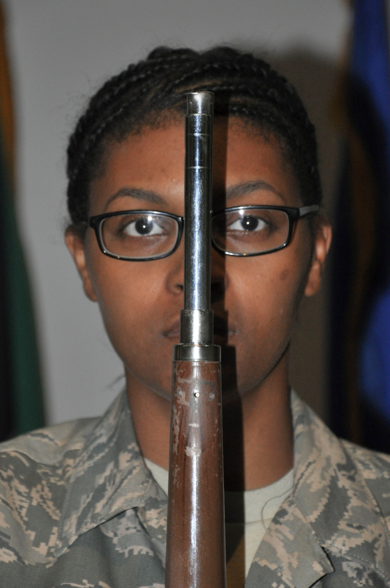 Ceremonial guardsman Senior Airman Shawnell Curry demonstrates unflinching bearing while bearing her rifle at the position of attention Tuesday, May 30, 2017, at the base theater at an undisclosed location in Southwest Asia..  Curry is a reservist deployed from the 30th Aerial Port Squadron at Charleston Air Force Base, S.C.