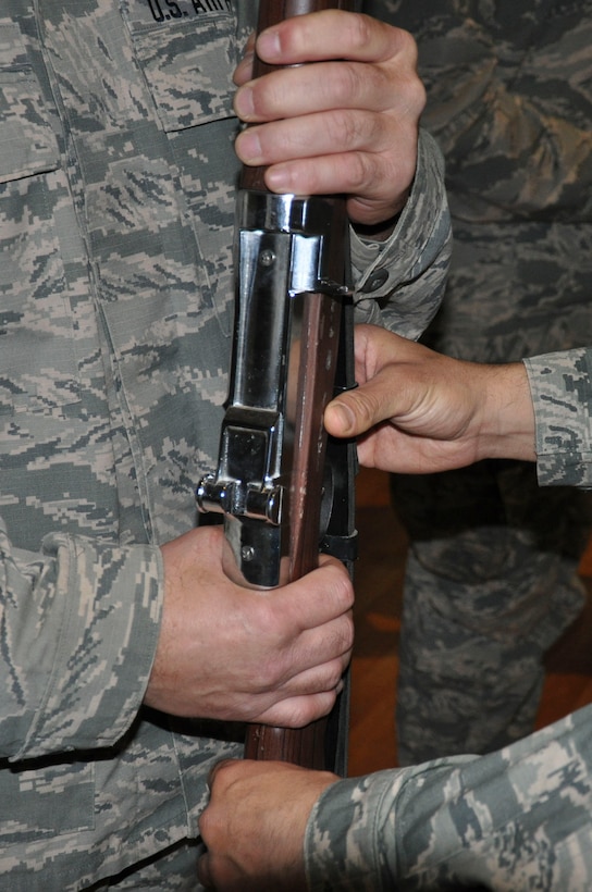 Every detail perfect. Adolfo makes a find adjustment to the angle at which a team member holds his rifle Tuesday, May 30, 2017, at the base theater at an undisclosed location in Southwest Asia. Honor guard movements are grounded on exacting precision and synchronization between each team member.