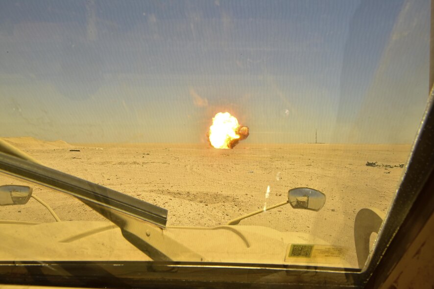 A controlled detonation blasts during a disposal operation in Southwest Asia, June 6, 2017. Personnel from the 407th Expeditionary Civil Engineer Squadron EOD, U.S. Marine Corps Special Marine Air Ground Task Force EOD and Italian Air Force completed the task of disposing of more than 5,000 pieces of expired 30 mm rounds and aircraft decoy flares. EOD’s mission is to protect personnel, resources, and the environment from hazardous explosive ordnance, improvised explosive devices and weapons of mass destruction, which may include; incendiary, chemical, biological, radiological, and nuclear hazards.  They specialize in tools, techniques and personal protective equipment to detect or identify, monitor, evaluate, interrogate, mitigate, render safe, recover, and disposal operations on ordnance or devices delivered, placed, or made dangerous by any circumstances. (U.S. Air Force photo by Senior Airman Ramon A. Adelan)