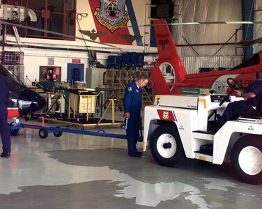 Air Station Detroit, Michigan
Original photo caption: "MOUNT CLEMENTS, MICH. -- Aircraft mechanics at Coast Guard Air Station Detroit prepare to pull an HH-65A 'Dolphin' helicopter out to the flight line."; photo is dated 14 September 2001; photo number 010914-C-2377C-507 (FR); photo by PA1 Harry C. Craft, III, USCG."