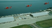 Air Station Elizabeth City, North Carolina
Original photo caption: "Taking advantage of a rare opportunity, Coast Guard pilots at Aircraft Repair and Supply Center (ARSC) in Elizabeth City, N.C., flew three different class[es] of helicopters in a tight flight formation.  The GG-65A (#6536--one of the last A models) was on a pre-induction Depot Maintenance flight.  HH-65B (#6578) was on a post-induction Depot Maintenance flight, and HH-65C (#6584) was in test flight phase following re-engining at ARSC.  Annually, ARSC personnel induct 23 HH-65 helicopter[s] for Depot Level Maintenance and is currently involved with re-engining the helicopter fleet.  The HH-65B models are being re-engined and should be completed by February 2007 becoming HH-65C models.  The Coast Guard's current fleet of 95 HH-65 helicopters is deployed at 17 air stations.  ARSC provides air stations with depot level maintenance, engineering, supply and information services to support Coast Guard missions."; photo is dated 13 June 2005; photo number 050613-C-0000A-001 (FR); photo by Ed W. Huntington, ARSC Elizabeth City.

