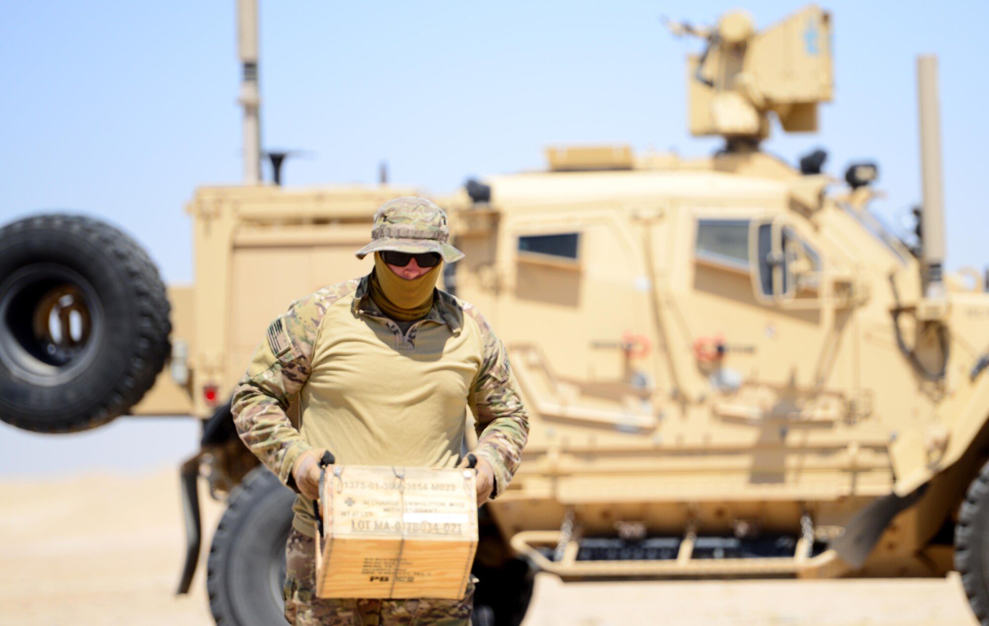 U.S. Air Force explosive ordnance disposal technicians assigned to the 407th Expeditionary Civil Engineer Squadron, carry C-4 explosives to the blast site at the range during a coordinated detonation in Southwest Asia on June 6, 2017. Explosive ordnance disposal technicians are charged with locating, identifying, disarming, neutralizing, recovering, and disposing of hazardous explosives; conventional, chemical, biological, incendiary, and nuclear ordnance; and criminal or terrorist devices.  (U.S. Air Force photo by Tech Sgt. Andy M. Kin)