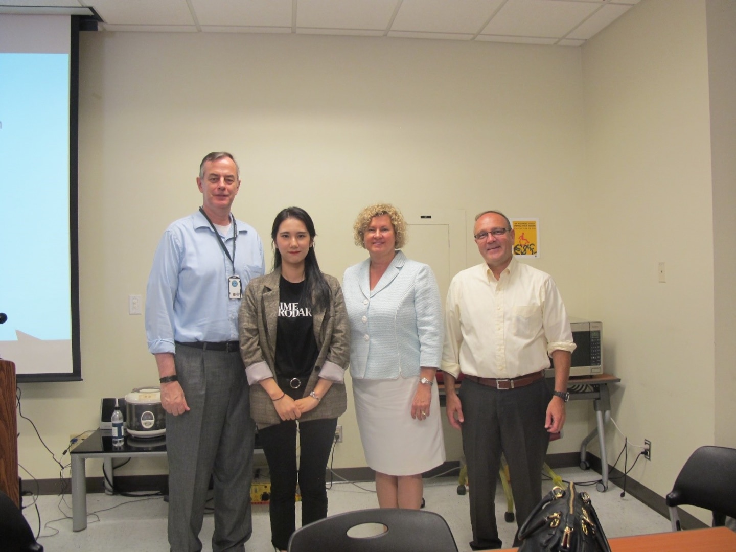 From right to left: James Diliberti, DLA general council and game show host; Melinda Davis-Perritano, SES, deputy general counsel and ethical subject matter expert; Geon Hee Park, college intern and translator; David Harris, deputy commander, DLA Distribution Korea and score keeper for round one. 