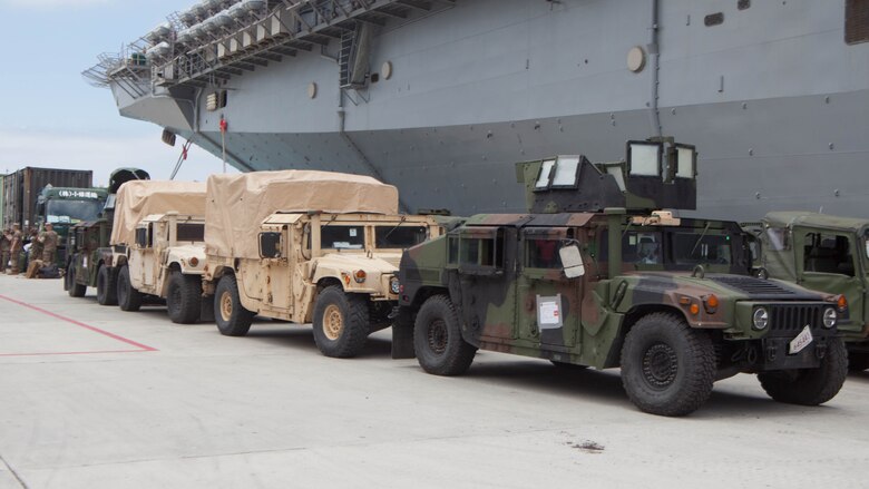 Humvees belonging to the 31st Marine Expeditionary Unit sit pier side at White Beach Naval Facility, Okinawa, Japan, June 7, 2017. The 31st MEU partners with the Navy’s Amphibious Squadron 11 to form the Bonhomme Richard Expeditionary Strike Group – a cohesive blue-green team capable of accomplishing a variety of missions across the Indo-Asia-Pacific.