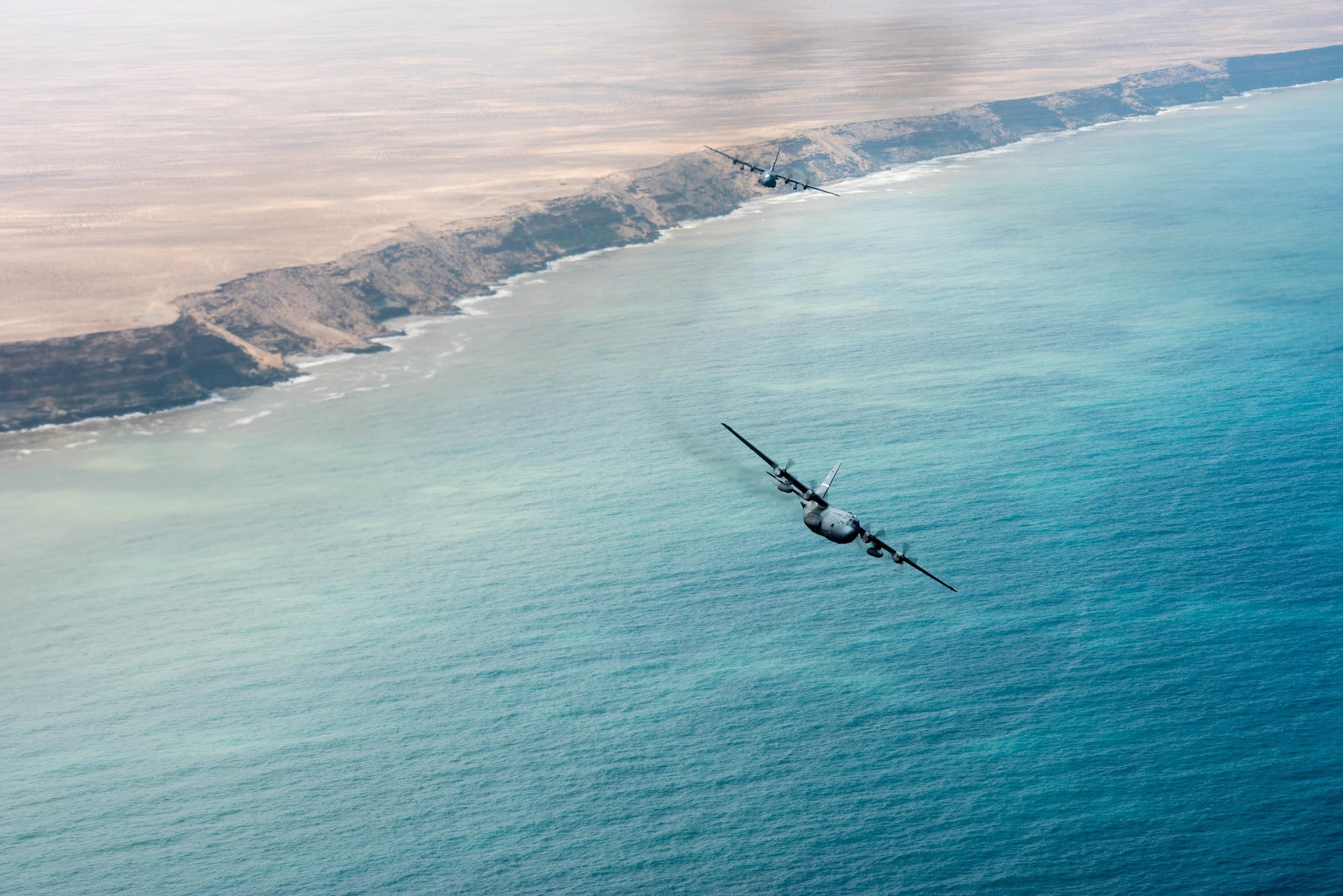 Two Kentucky Air National Guard C-130 Hercules fly over the coast of North Africa on April 25, 2017. Various units from the U.S. Marine Corps, U.S. Army, U.S. Navy, U.S. Air Force and the Kentucky and Utah Air National Guards will conduct multilateral and stability operations training with units from the Royal Moroccan Armed Forces in the Kingdom of Morocco. This combined multilateral exercise is designed to improve interoperability and mutual understanding of each nation’s tactics, techniques and procedures while demonstrating the strong bond between the nation’s militaries. (U.S. Air Force photo by Master Sgt. Phil Speck)