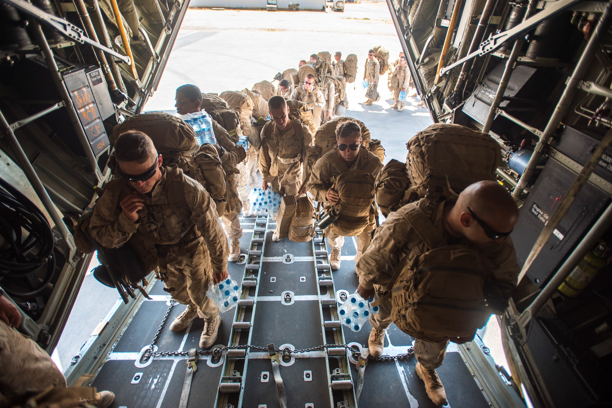 U.S. Marines board a Kentucky Air National Guard C-130 Hercules at Guelmim Airport in Morocco on April 27, 2017, during Exercise African Lion. Multiple units from the U.S. Marine Corps, U.S. Army, U.S. Navy, U.S. Air Force and the Kentucky and Utah Air National Guards conducted multilateral and stability operations training with units from the Royal Moroccan Armed Forces in the Kingdom of Morocco during the exercise, which ran from April 19 to 28. The annual combined multilateral exercise is designed to improve interoperability and mutual understanding of each nation’s tactics, techniques and procedures while demonstrating the strong bond between the nations’ militaries. (U.S. Air Force photo by Master Sgt. Phil Speck)