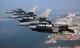 A three-ship formation of Air National Guard F-16 Fighting Falcons flies over Kunsan City, South Korea. The F-16s are from New Mexico, Colorado and Montana. (U.S. Air Force photo/Tech. Sgt. Jeffrey Allen)
