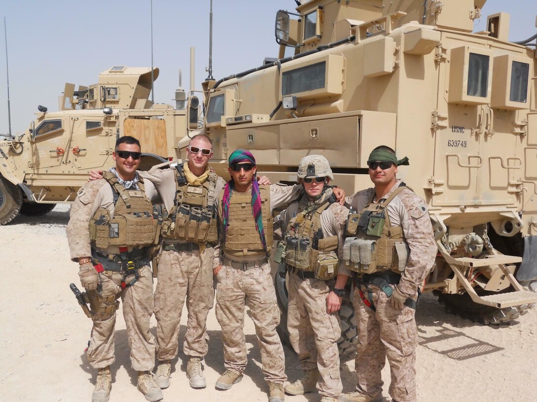 Mohammad Nadir (center) poses with a group of Marines during a base construction project for the Afghan police in Helmand province, Afghanistan. Nadir served as an interpreter for the International Security Assistance Force for nearly three years before applying for a Special Immigrant Visa that would allow him to immigrate to the U.S. After working closely with the Marines, Nadir decided he wanted to follow suit and enlisted in the Marine Corps in February 2017 as an 0311 infantryman.