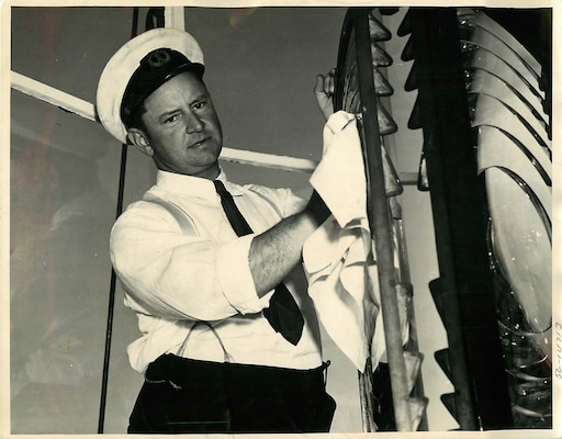 Light Station Boston, Massachusetts
Keeper of Boston Light, Ralph Norwood, BM 2nd Class, US Coast Guard, working on burner of light.  Boston Light, situated on Lighthouse Island in Boston Harbor, celebrating its 58th anniversary, September 14, 1941.
Negative number: NYD 90741005 USCG