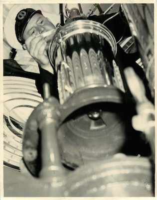 Light Station Boston, Massachusetts
Keeper of Boston Light, Ralph Norwood, BM 2nd Class, US Coast Guard, working on burner of light.  Boston Light, situated on Lighthouse Island in Boston Harbor, celebrating its 58th anniversary, September 14, 1941.
