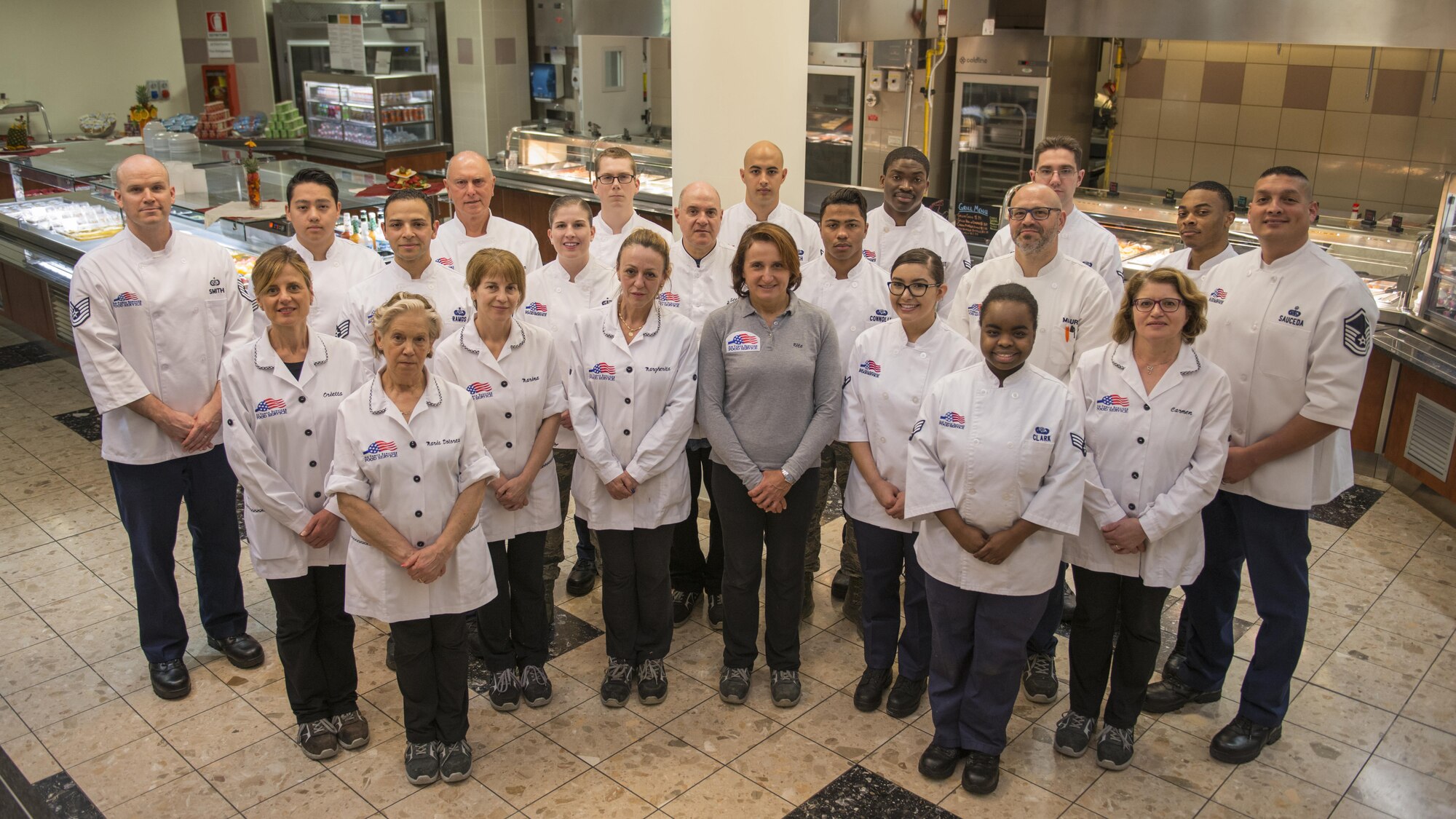 The 31st Force Support Squadron La Dolce Vita Dining Facility staff poses for a picture May 26, 2017, at Aviano Air Base, Italy. The welfare of Airmen and Soldiers is a top priority for the 31st Force Support Squadron, the dining facility’s mission is to provide military members the fuel needed to sustain the 31st Fighter Wing mission. (U.S. Air Force photo by Senior Airman Cory W. Bush)