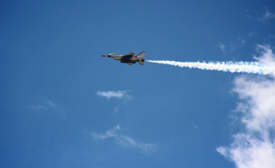 An F-16 Thunderbird aircraft zooms over the area 7 June, 2017, near the 932nd Airlift Wing, as part of the preparations for the upcoming Scott Air Force Base Air Show on June 9-10.  The weekend show is open to the public and gates will open at 9 a.m. Saturday and Sunday.  The 932nd Airlift Wing recruiters and C-40C plane will be available for photos and interaction during the two day event.  See the Scott AFB webpage for more information and latest schedules.  (U.S. Air Force photo by Lt. Col. Stan Paregien)