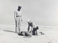 Coast Guard Station Tiana, Hampton Bay, Long Island, New York 1942-1944
"APPLYING ARTIFICIAL RESPIRATION TO 'VICTIM' AT TIANA LIFEBOAT STATION."
Courtesy of Kenneth Sutherland
