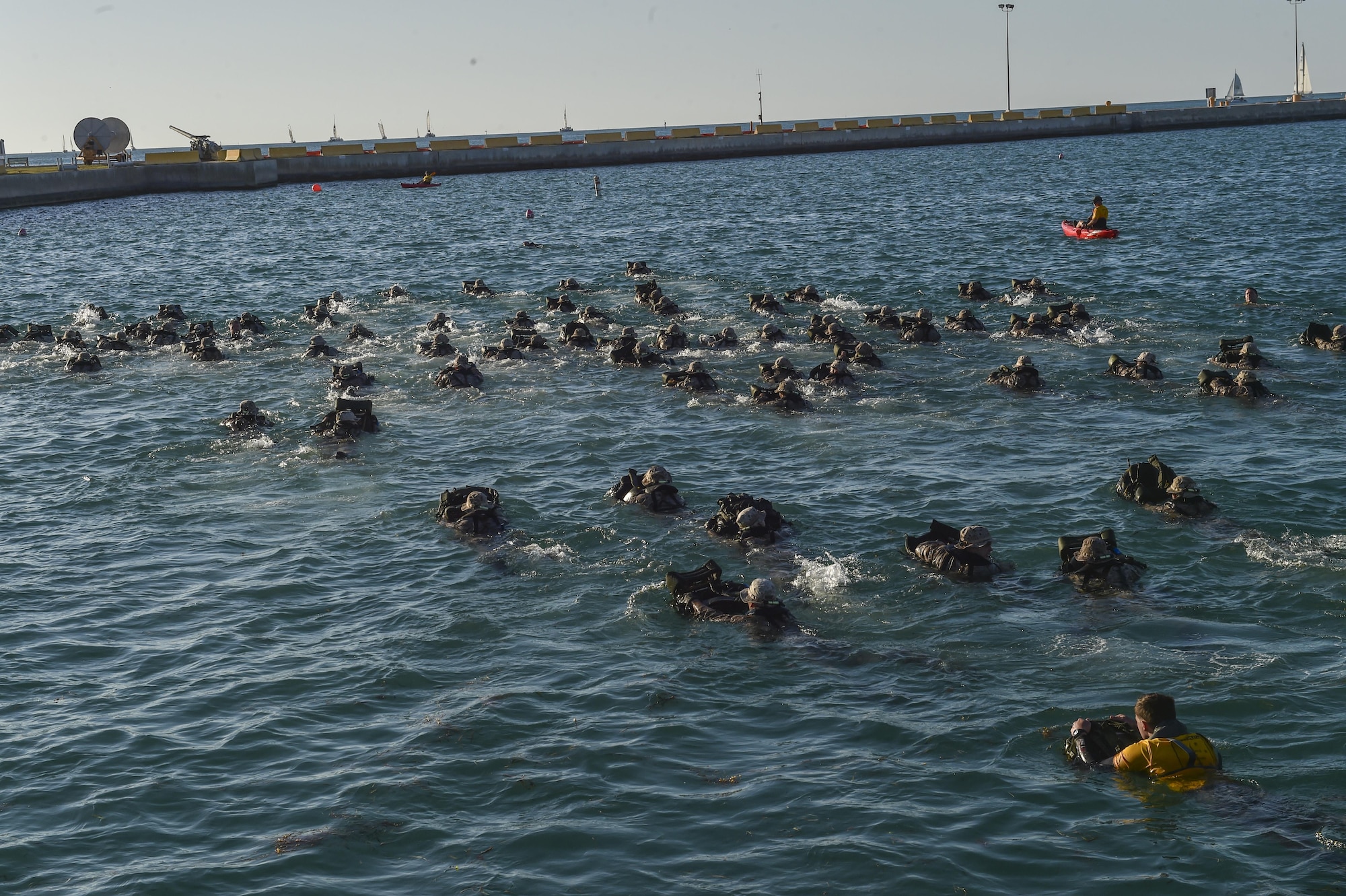 Marine Special Operations School Individual Training Course students perform a 2,000 meter swim, March 20, 2017, at Key West, Fla. For the first time, U.S. Air Force Special Tactics Airmen spent three months in Marine Special Operations Command’s Marine Raider training pipeline, representing efforts to build joint mindsets across special operations forces.  (U.S. Air Force photo by Senior Airman Ryan Conroy)