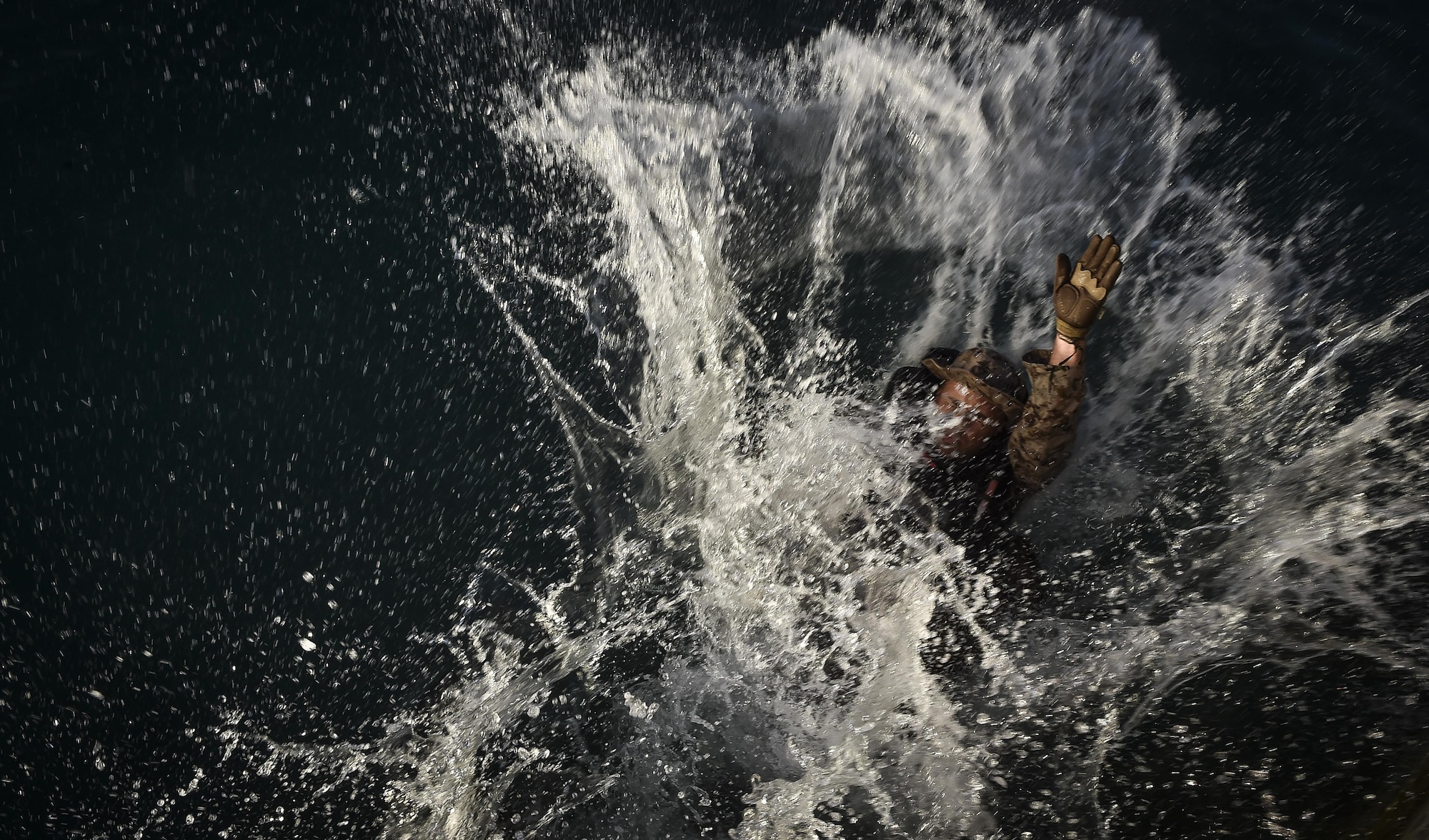 A U.S. Marine practices helocasting off a sea wall during Marine Special Operations School’s Individual Training Course, March 21, 2017, at Key West, Fla. For the first time, U.S. Air Force Special Tactics Airmen spent three months in Marine Special Operations Command’s Marine Raider training pipeline, representing efforts to build joint mindsets across special operations forces.  (U.S. Air Force photo by Senior Airman Ryan Conroy)