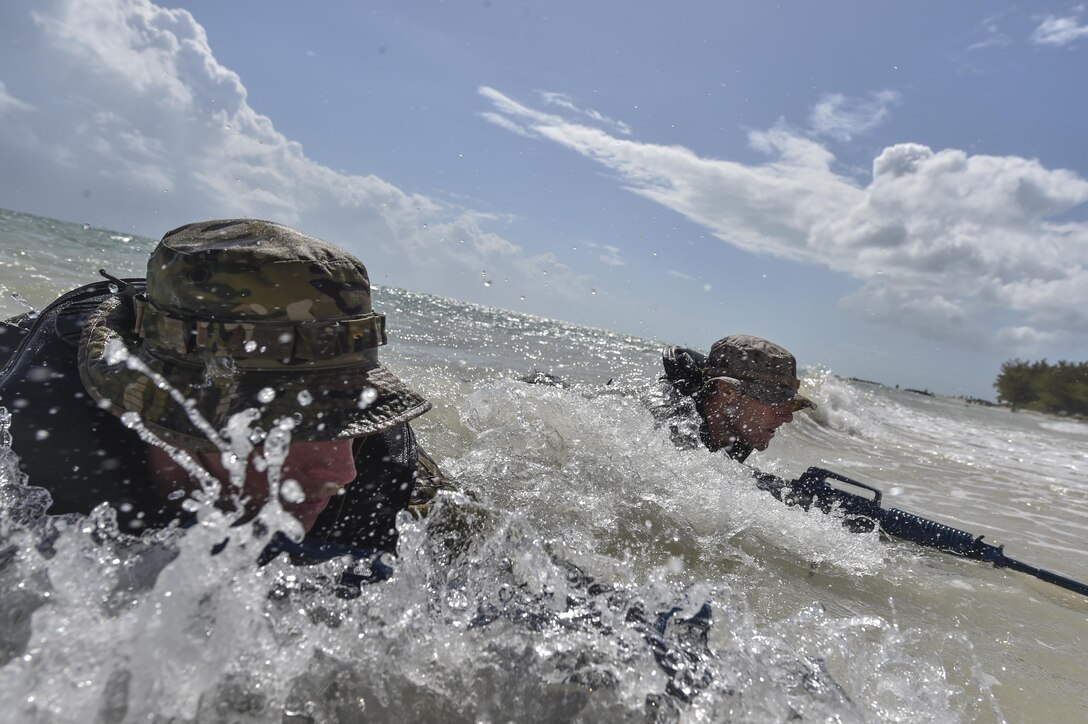 A U.S. Marine and Airman perform scout swimmer training during Marine Special Operations School’s Individual Training Course, March 24, 2017, at Key West, Fla. For the first time, U.S. Air Force Special Tactics Airmen spent three months in Marine Special Operations Command’s Marine Raider training pipeline, representing efforts to build joint mindsets across special operations forces.  (U.S. Air Force photo by Senior Airman Ryan Conroy)